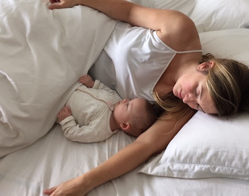 woman and baby cosleeping